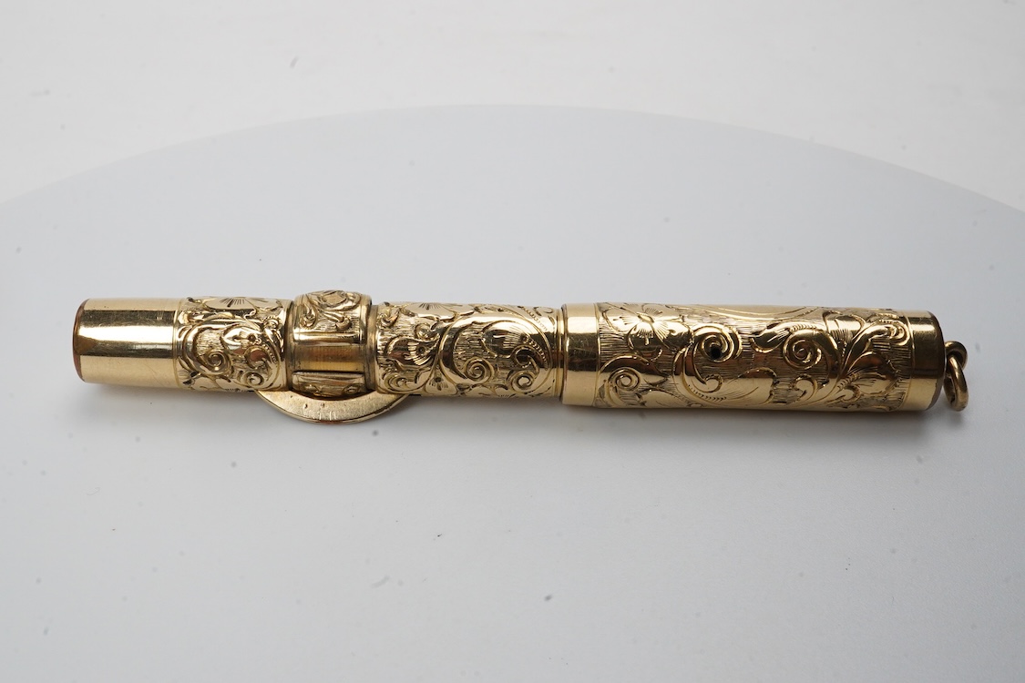A Conklin ring top hand engraved crescent filler fountain pen with 14ct. gold Conklin nib